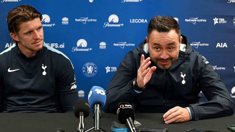Tottenham Hotspur's head coach Roberto De Zerbi (R) and player Conor Gallagher attend a press conference
