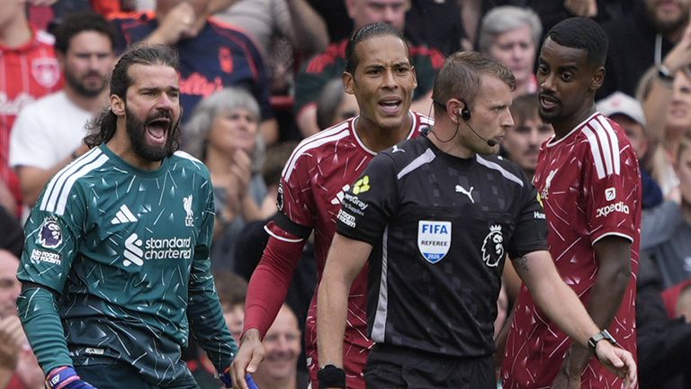 Liverpool players fume at referee Samuel Barrott after he awarded Nottingham Forest a penalty at Anfield